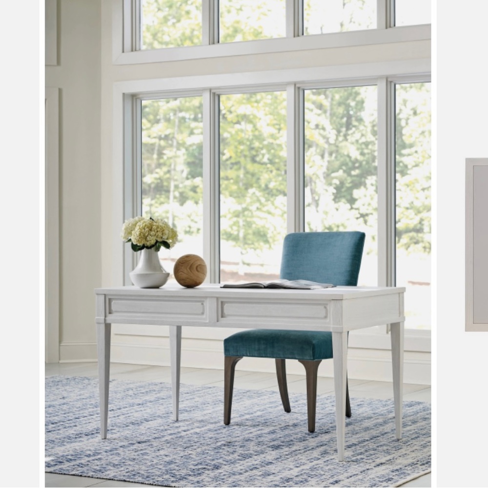 We have a Sanibel Valencia White Writing Desk.